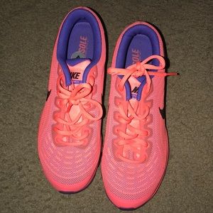 Women’s neon colored Nike sneakers